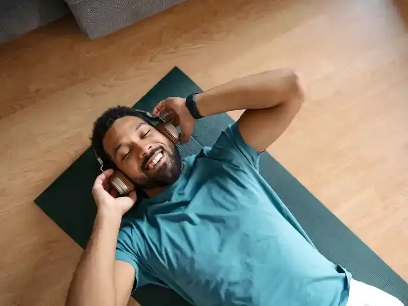 Man relaxing on floor.