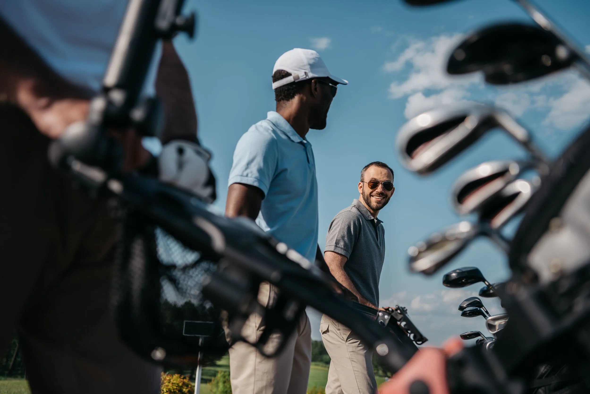 Golfer and caddy.